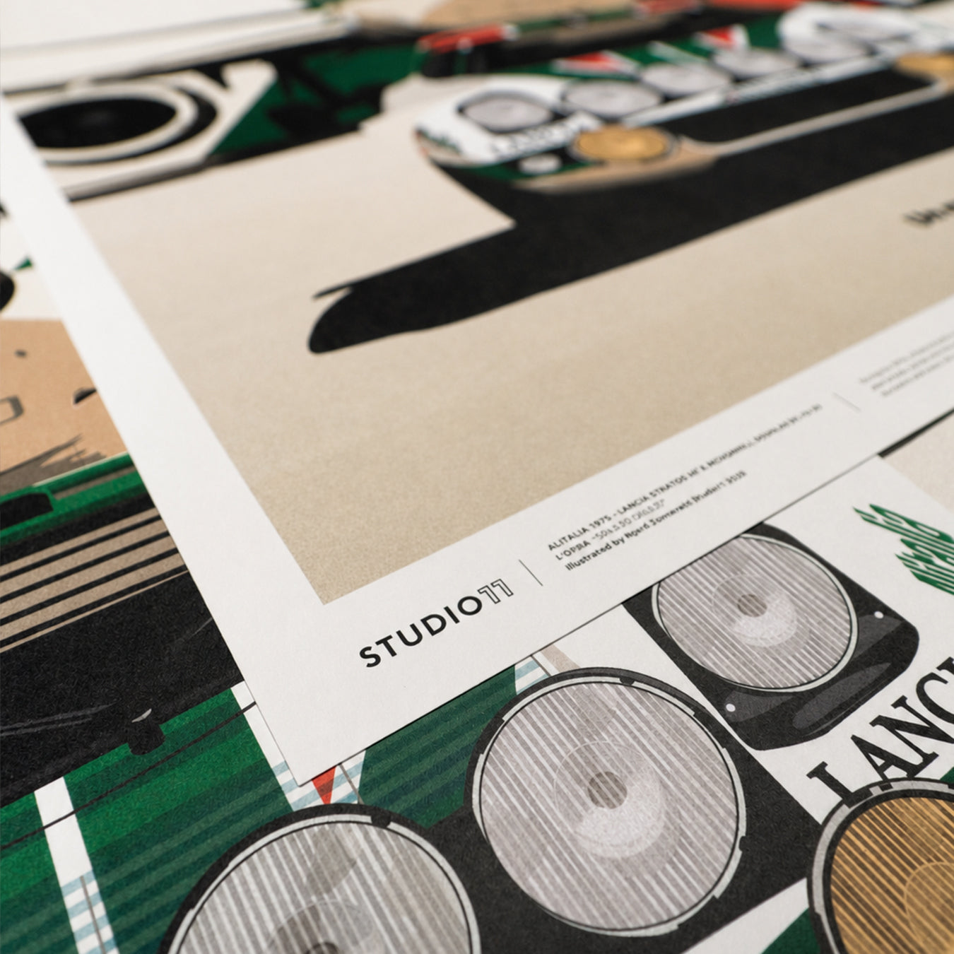 Close-up of the Studio11 signature, fine-art paper texture and detailed rally lights on the Alitalia Lancia Stratos artwork.
