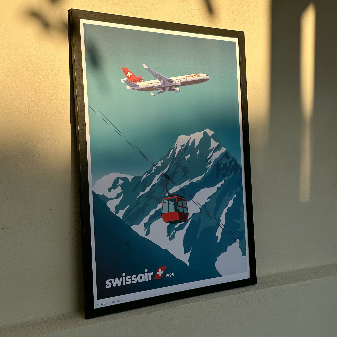 Swissair MD-11 flying over the Swiss Alps with a ski gondola in the foreground, capturing a serene retro aviation scene in premium illustration style.